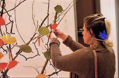 Eleanor attaches her leaf-card to the dream tree.